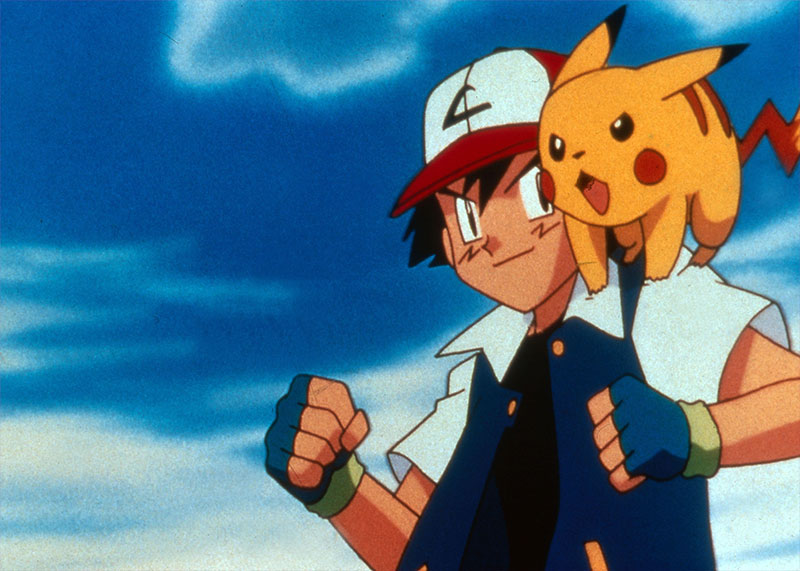 Ash en pose de combate con Pikachu reposado en su hombro.