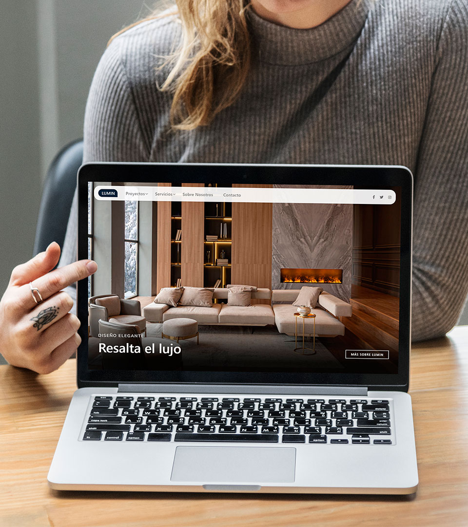 Woman points to a laptop screen showing the website.